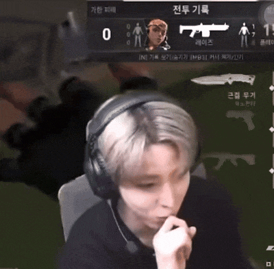 a man wearing headphones is playing a video game with a knife on the screen
