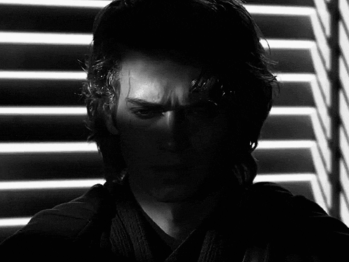 a close up of a man 's face in a black and white photo .