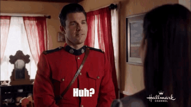 a man in a red uniform says huh on the screen