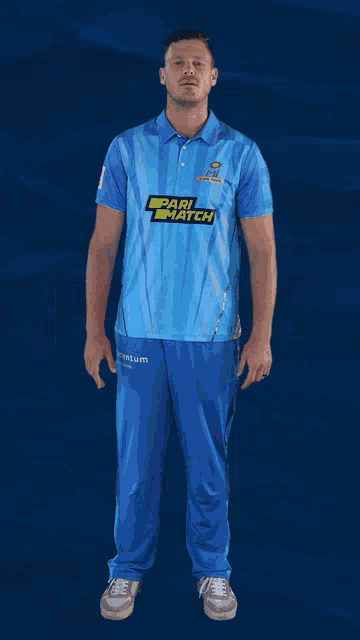 a man wearing a blue shirt with pari match on it