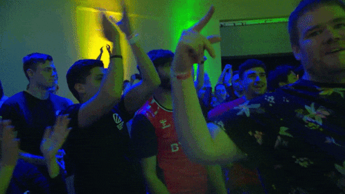 a man wearing a red shirt with the letter b on it