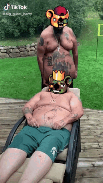 a man laying in a chair with a big gucci berry tattoo