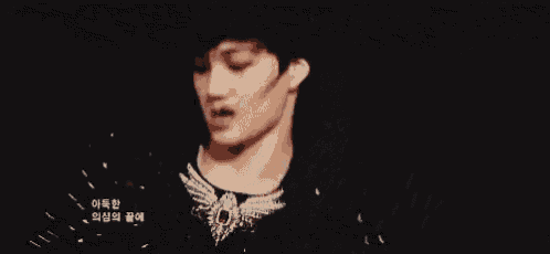 a close up of a person 's face with a microphone on their neck .