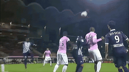 a soccer player in a pink jersey with the number 9 on it