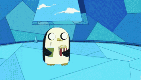 a penguin is holding a drink and popcorn