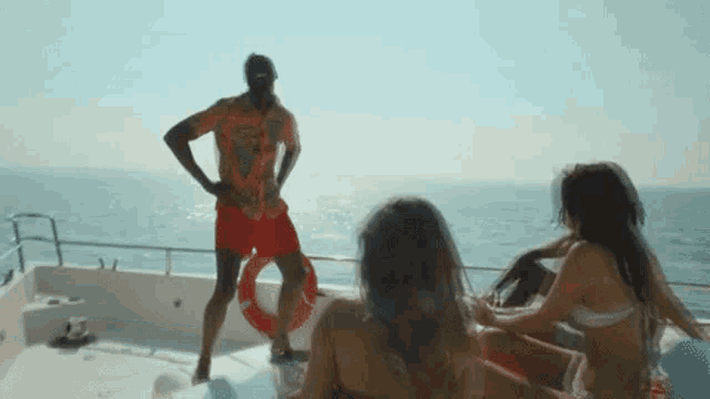a group of people are on a boat in the ocean