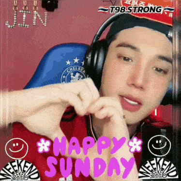 a man wearing headphones is making a heart shape with his hands and the words happy sunday behind him