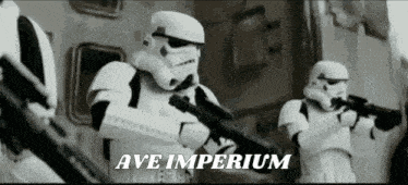 a group of stormtroopers holding guns in a black and white photo with the words ave imperium written on the bottom .