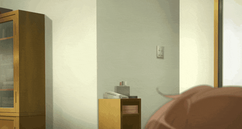 a room with a telephone on a shelf and a cabinet