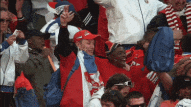 a man wearing a red hat that says ' uefa ' on it
