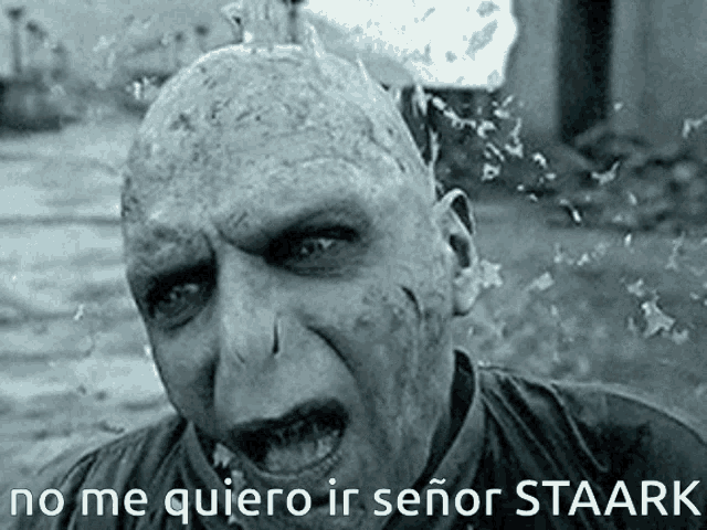 a black and white photo of a man with the words " no me quiero ir señor staark " on the bottom