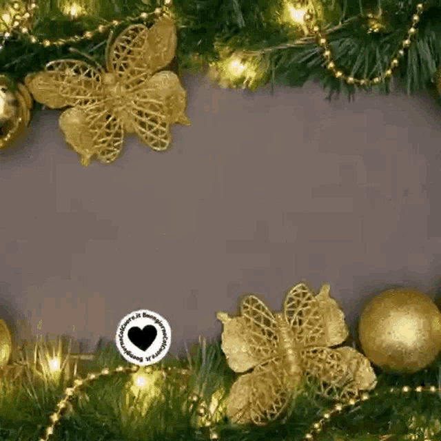 a christmas card with a christmas tree , balls , flowers , and lights .