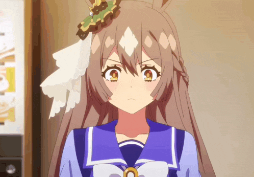 a girl with a flower in her hair is wearing a blue sailor suit