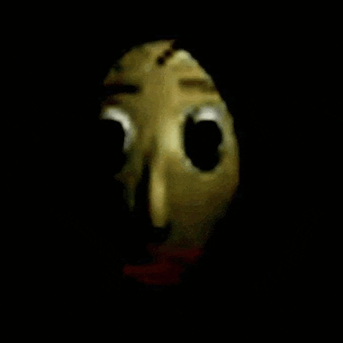 a close up of a cartoon character 's face with big eyes in the dark .
