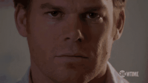 a close up of a man 's face looking at the camera .