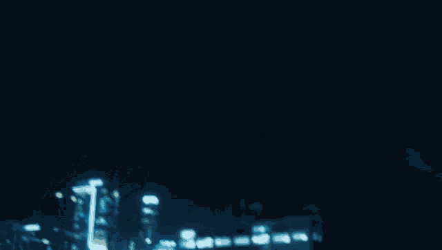 a blurry picture of a person in a blue room