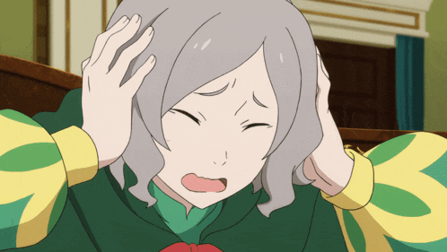 a girl with gray hair and a green and yellow shirt is holding her head