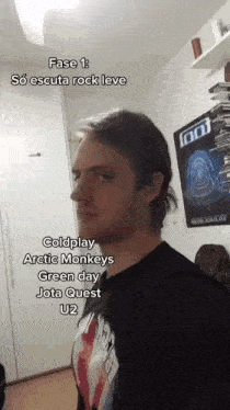 a man is standing in front of a poster that says foo
