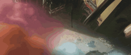a red and blue smoke coming out of a window