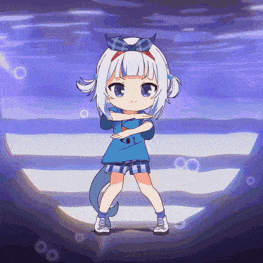 a little girl with a blue shirt that says ' shark ' on it