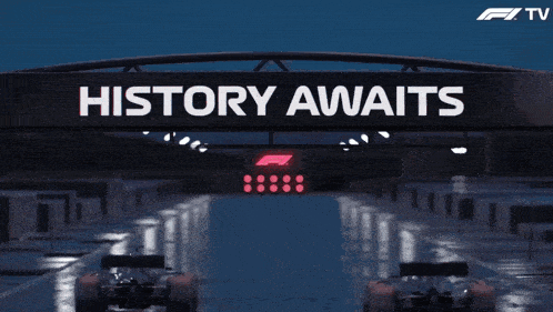 a sign that says " history awaits " above a race track