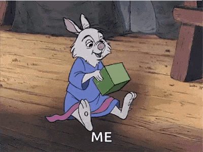 a cartoon rabbit is sitting on a wooden floor holding a green box and says `` me '' .