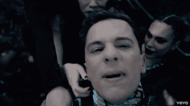 a close up of a person 's face with the word vevo on the bottom left
