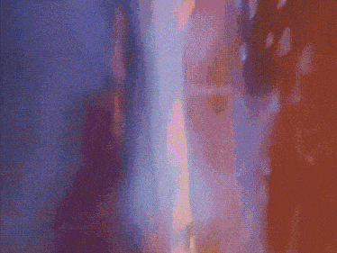 a close up of a purple and orange background with a blurred image