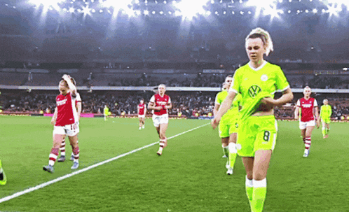 a soccer player with the number 8 on her jersey