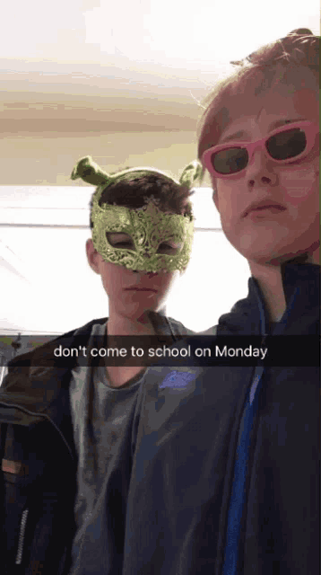 two boys wearing masks and sunglasses with the caption " do n't come to school on monday " on the bottom