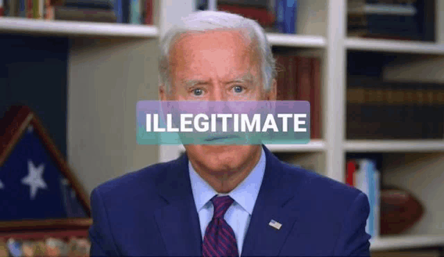 a man in a suit and tie stands in front of a sign that says illegitimate