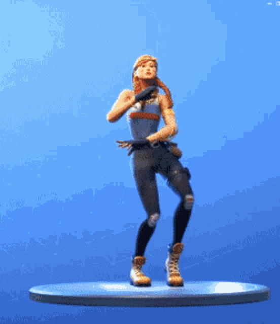 a figurine of a woman is dancing on a platform