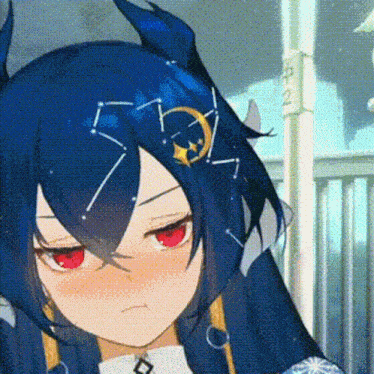 a blue haired anime girl with red eyes and a crescent moon on her head .
