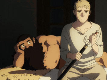 a man holding a sword sits next to a man with a beard