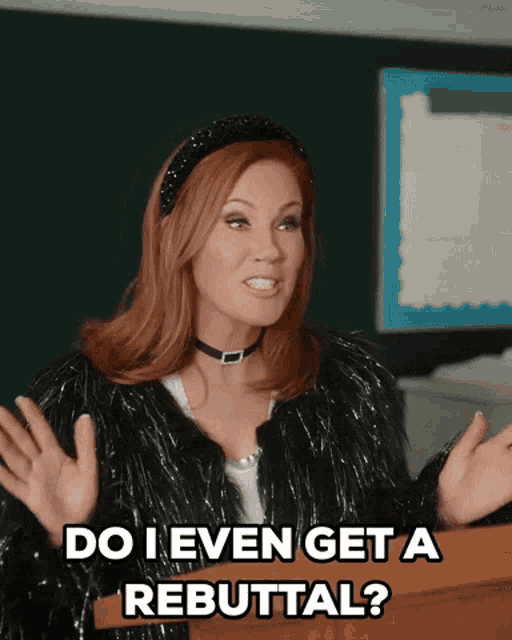 a woman stands at a podium saying do i even get a rebuttal