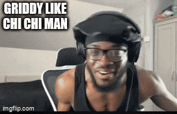 a man wearing headphones and glasses is sitting in a chair .