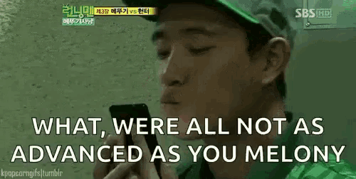 a man talking on a cell phone with the words " what were all not as advanced as you melony "