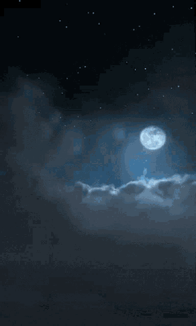 a full moon shines through the clouds in a dark night sky