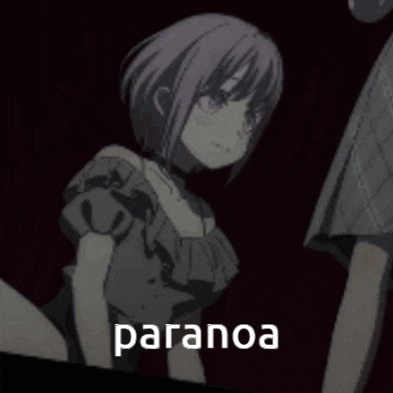a girl with purple hair is sitting next to a man in a dark room with the word paranoa .