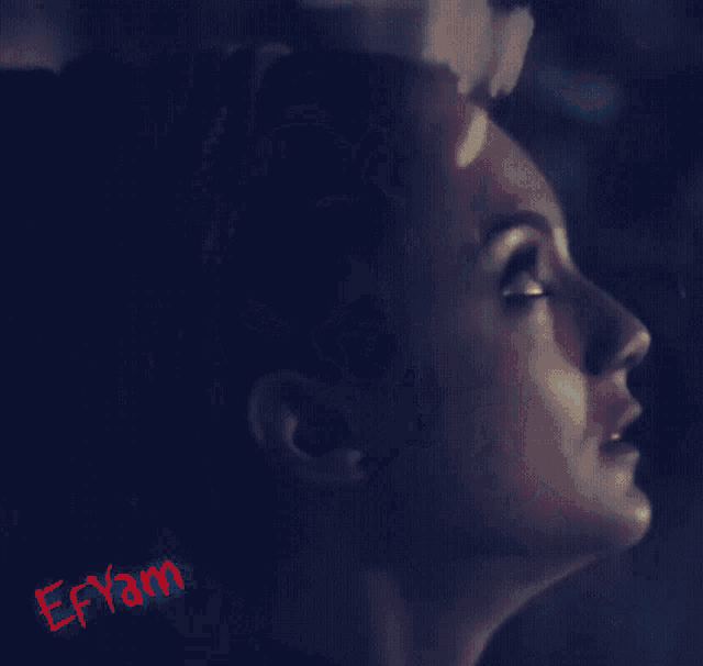 a close up of a woman 's face with the name eryam on the bottom right