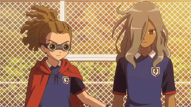 two anime characters standing next to each other with one wearing a shield with the letter b on it