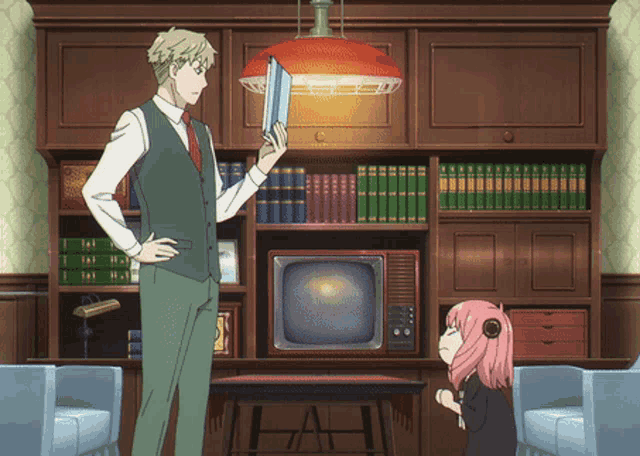 a man and a girl are standing in front of a bookshelf and a tv