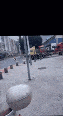 a truck with the word volvo on the side is parked on the side of the road
