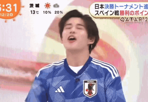 a man is wearing a soccer jersey that says japan