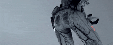 a woman in a futuristic suit is standing on a snowy surface .
