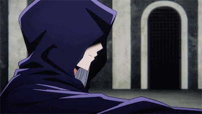 a man in a black hooded cape is standing in front of a door