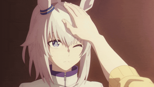 a person touching a girl 's head with a bunny ear