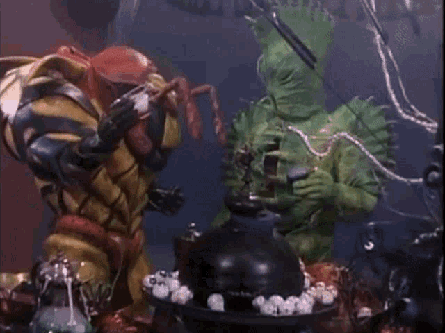 two monsters are fighting each other in a dark room