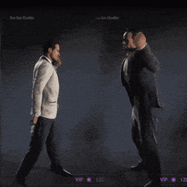 a man in a tuxedo is dancing with his hand in the air