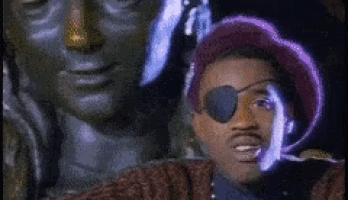a man with an eye patch and a purple hat
